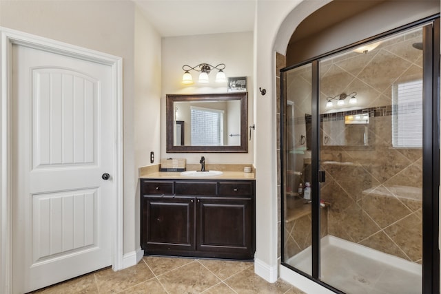 bathroom featuring walk in shower, tile flooring, and oversized vanity