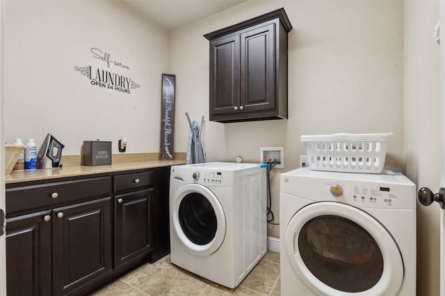 laundry area featuring cabinets, washing machine and dryer, hookup for a washing machine, and light tile floors