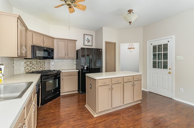 kitchen featuring ceiling fan, tasteful backsplash, black appliances, dark wood-type flooring, and a center island