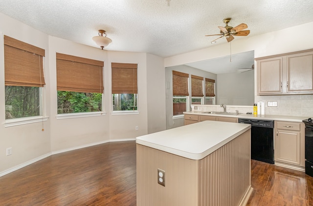 kitchen with dark hardwood / wood-style floors, a kitchen island, dishwasher, ceiling fan, and sink