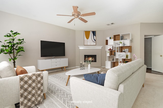 living room with ceiling fan and light carpet