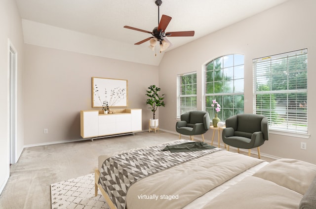 bedroom featuring carpet flooring, vaulted ceiling, and ceiling fan