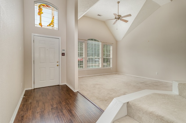 entrance foyer with high vaulted ceiling, a healthy amount of sunlight, dark wood-type flooring, and ceiling fan