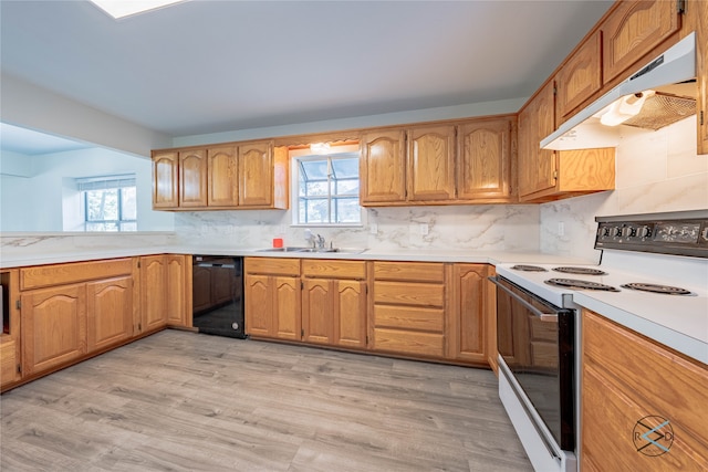 kitchen featuring tasteful backsplash, light wood-type flooring, white range with electric stovetop, black dishwasher, and sink