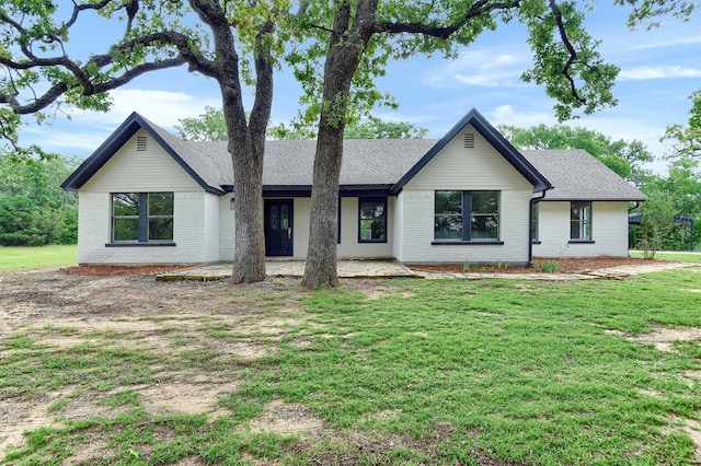 view of front of home with a front yard