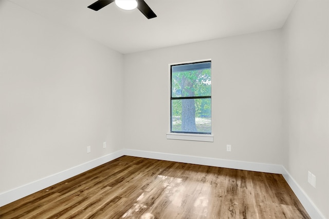 empty room featuring wood-type flooring and ceiling fan