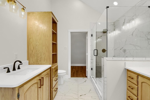 bathroom with a shower with door, tile flooring, vanity, and toilet