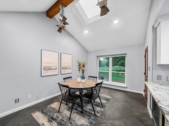 dining area with lofted ceiling with skylight