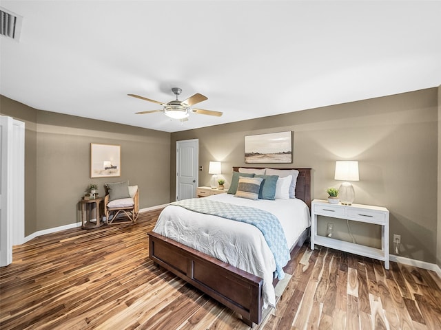 bedroom with hardwood / wood-style floors and ceiling fan