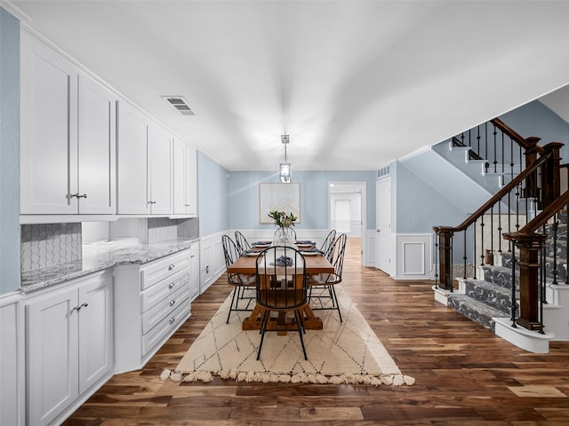 dining room with dark wood-type flooring