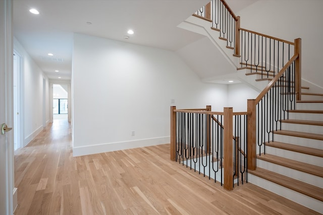 stairs with hardwood / wood-style flooring