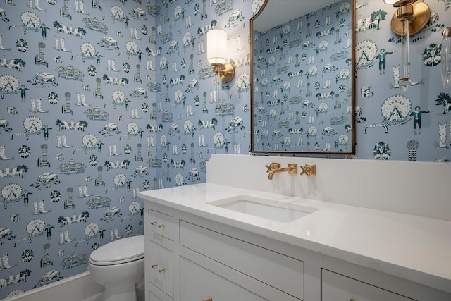 bathroom with vanity and toilet