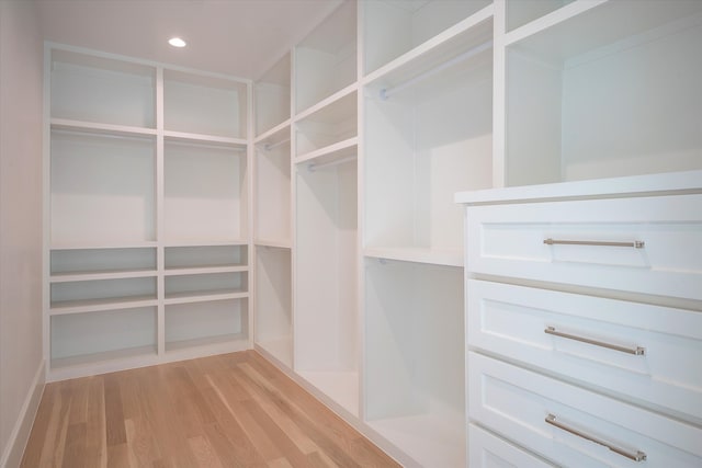 spacious closet with light hardwood / wood-style floors