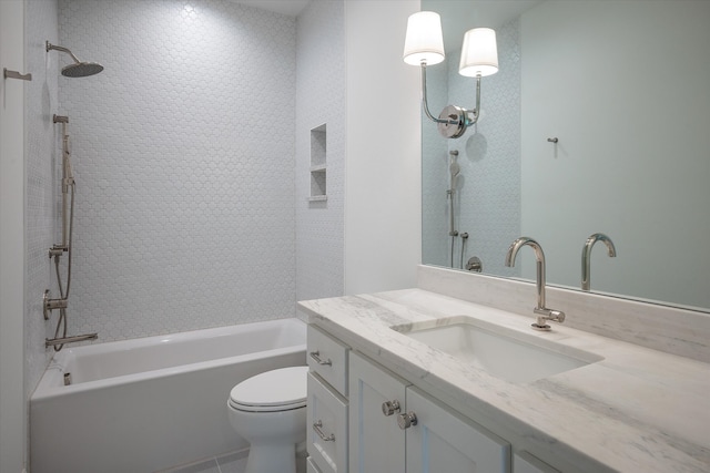 full bathroom featuring tiled shower / bath combo, tile patterned flooring, vanity, and toilet