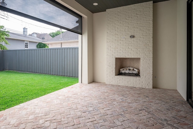 view of patio with an outdoor fireplace