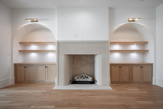 unfurnished living room with light wood-type flooring