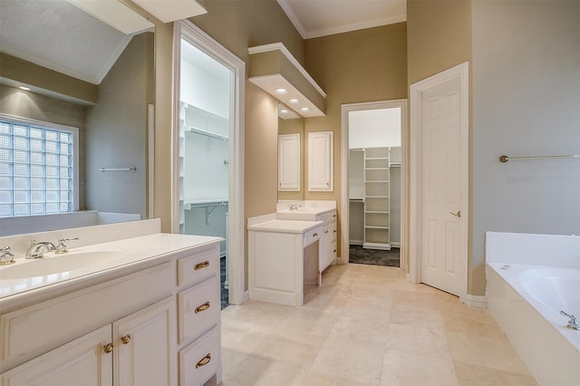 bathroom featuring tile patterned flooring, vanity, a bathtub, and crown molding