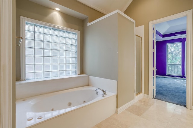 bathroom featuring a wealth of natural light, shower with separate bathtub, and ornamental molding