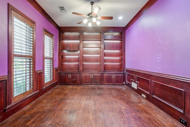 spare room featuring ornamental molding, hardwood / wood-style flooring, and ceiling fan