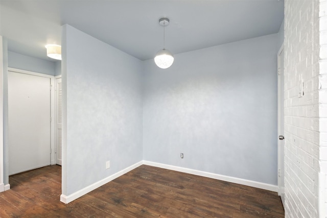 spare room featuring dark hardwood / wood-style flooring