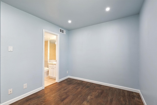 unfurnished room featuring dark hardwood / wood-style flooring