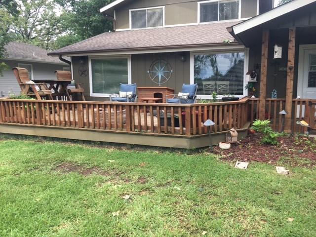 rear view of property with a yard