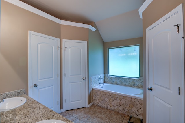 bathroom featuring dual bowl vanity, tile flooring, and tiled tub