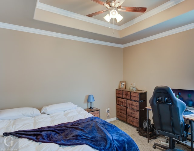 carpeted bedroom with crown molding, ceiling fan, and a raised ceiling