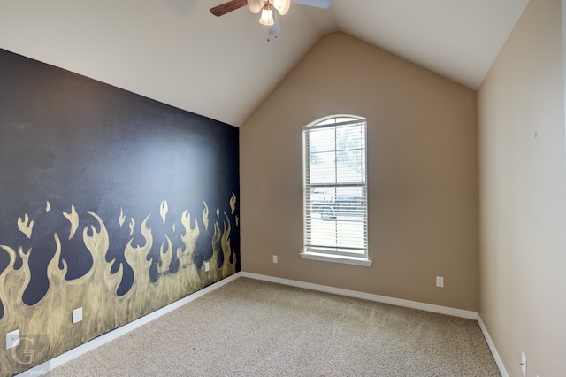 empty room featuring a healthy amount of sunlight, lofted ceiling, and carpet flooring