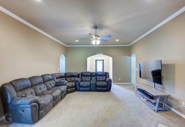 living room featuring carpet, ceiling fan, and crown molding