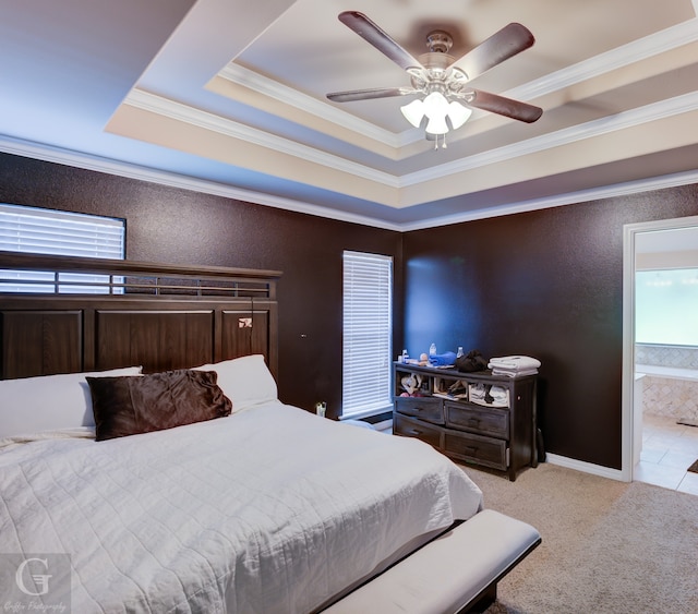 bedroom featuring multiple windows, ensuite bath, and crown molding