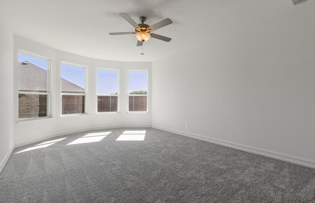 empty room featuring carpet and ceiling fan