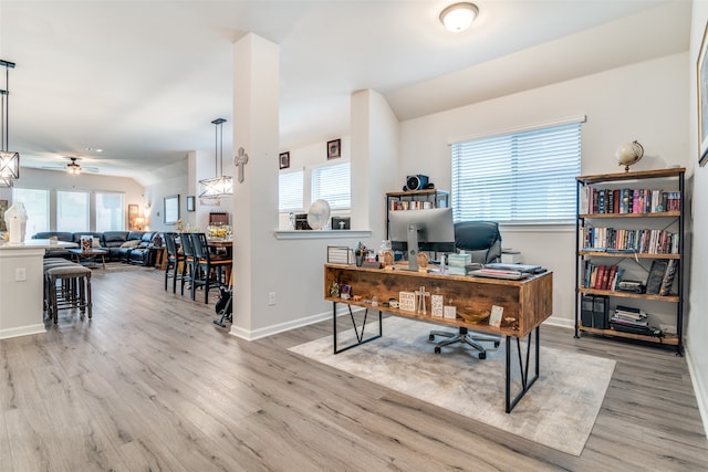 home office with ceiling fan, a healthy amount of sunlight, and hardwood / wood-style flooring