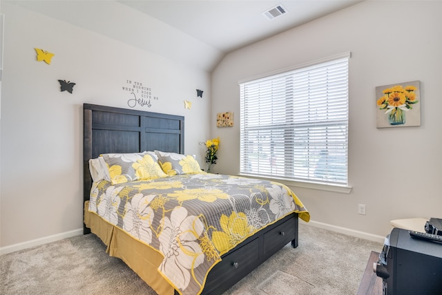 bedroom featuring carpet floors and vaulted ceiling