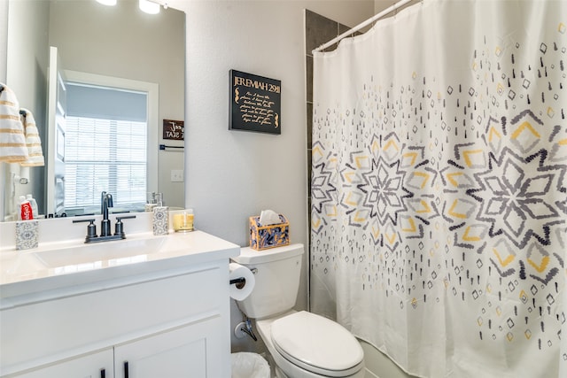 bathroom with oversized vanity and toilet