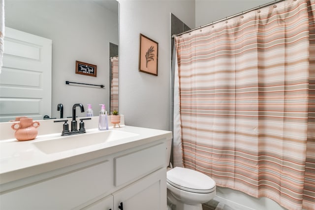 bathroom featuring oversized vanity and toilet