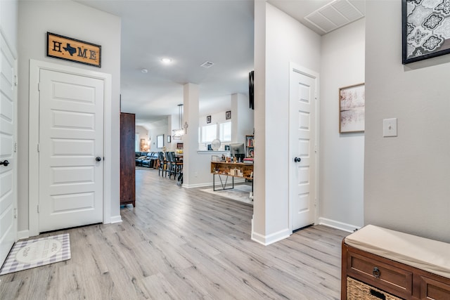 entryway with light hardwood / wood-style floors