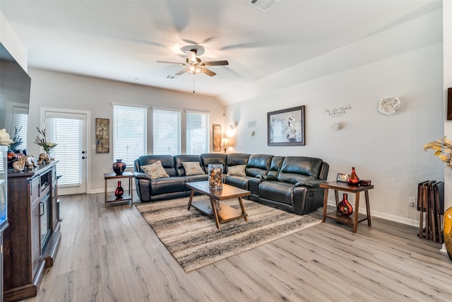 living room with ceiling fan and light wood-type flooring