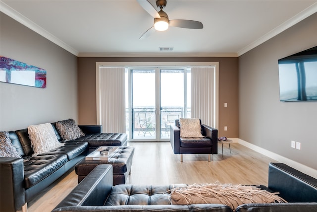 living room featuring ceiling fan, light hardwood / wood-style flooring, and ornamental molding