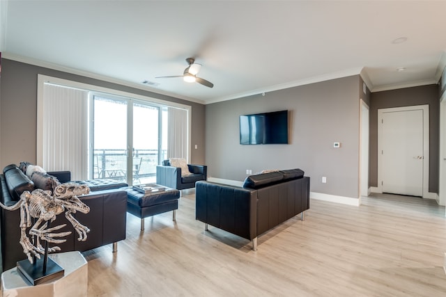 living room featuring ornamental molding, ceiling fan, and light wood-type flooring