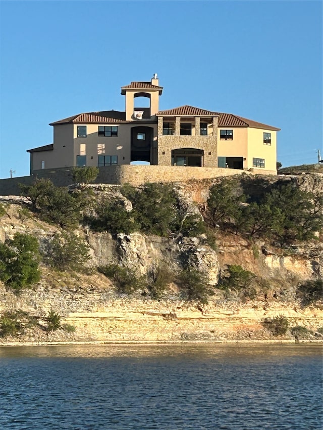 view of property with a water view