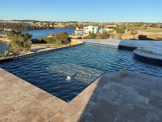 outdoor pool with a water view