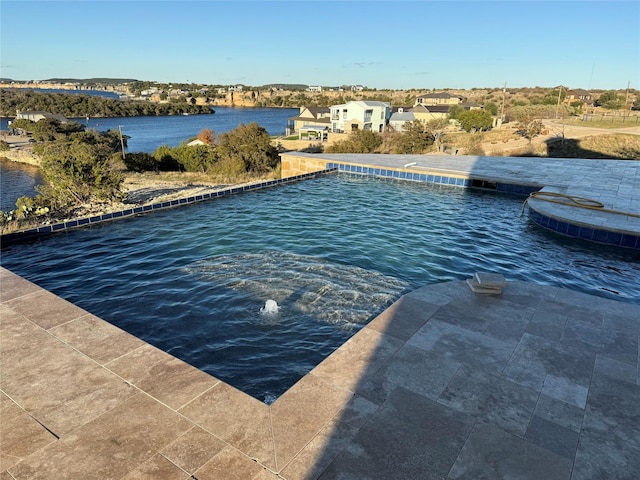 view of pool featuring a water view