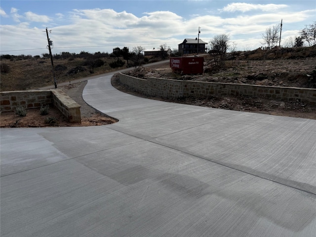 view of home's community featuring driveway