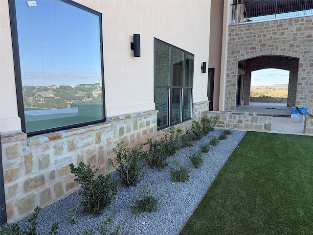 exterior space with a patio area and a lawn