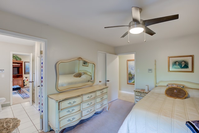 tiled bedroom with ceiling fan