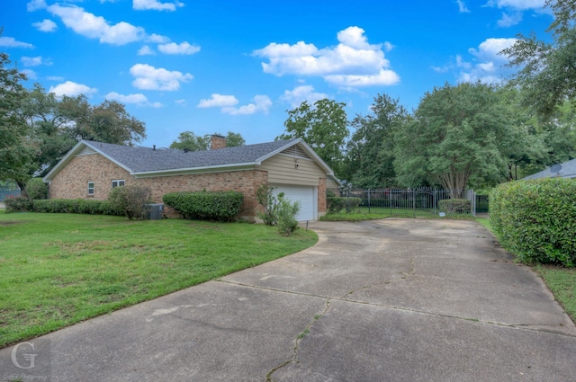 view of front of property featuring a garage and a front yard