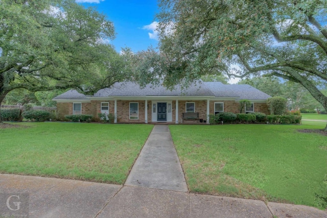 ranch-style house featuring a front lawn