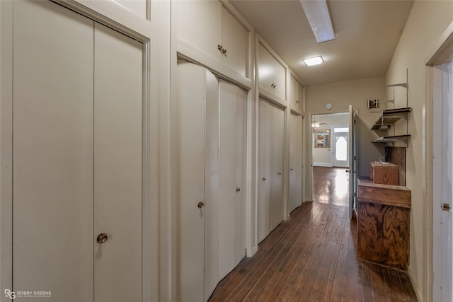 hall with dark hardwood / wood-style flooring