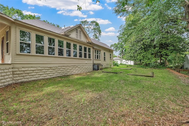 view of yard featuring central AC unit